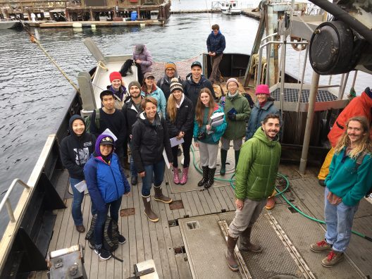 A group of students on a research boat.