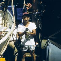Bell Shimada holding a penguin, circa 1957.