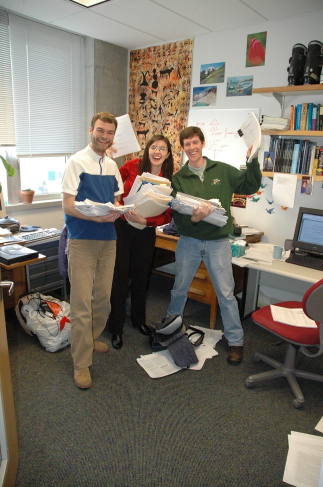 With my Lab mates, Arni Magnusson (MS, 2002; PhD, 2016) and Trevor Branch (PhD, 2004), on the day of my defense (November 5th 2004) holding many draft copies of my dissertation, ready for recycling.