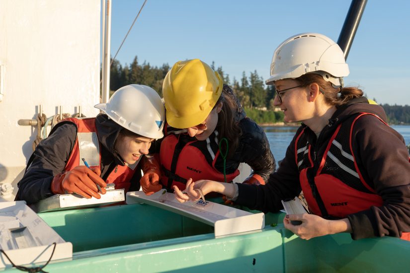 chelsea wood with two students looking at a fish