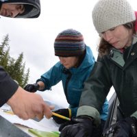 Conducting herring field work in Bella Bella, British Columbia in 2014. Richard Reid (Heiltsuk Coastal Guardian Watchmen), Eleni Petrou (UW) and Kira Krumhansl (SFU) subsample herring for genetic research.