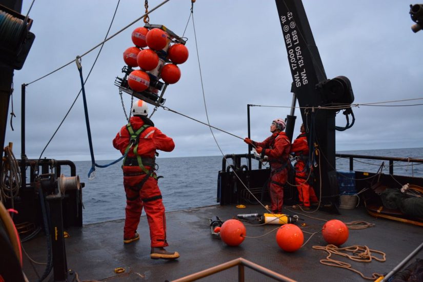 Researchers lowering the Chukchi Ecosystem Observatory (CEO) innto the Chukchi Sea. University of Alaska Fairbanks