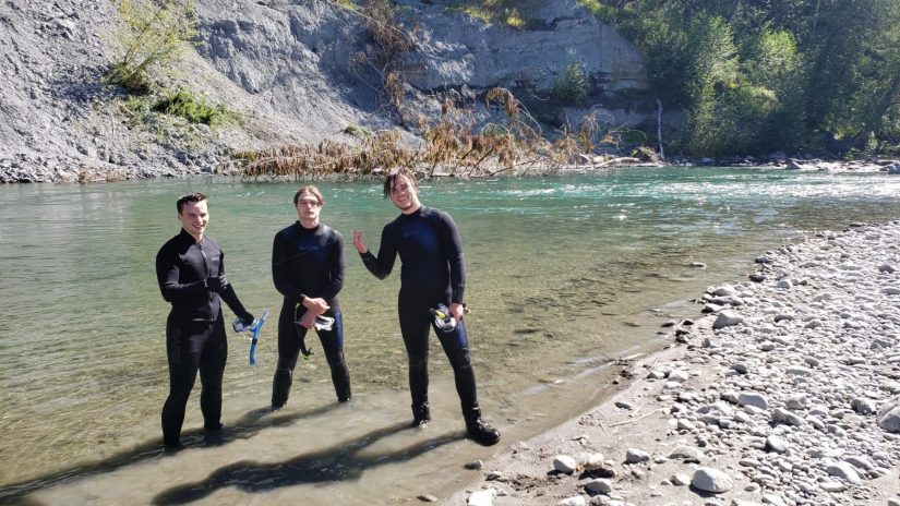 Josef and friends snorkeling in a river