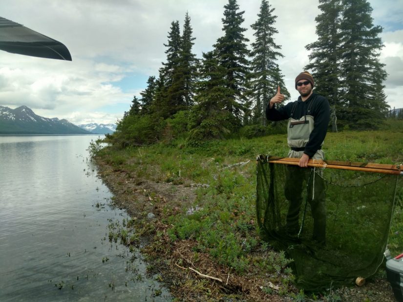 Lukas seining along a beach in Alaska