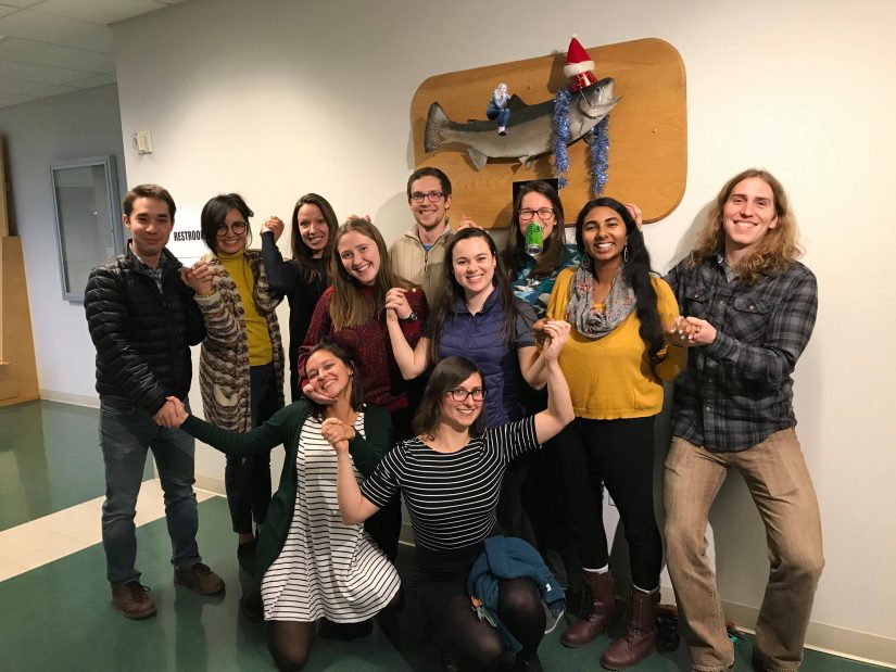SAFS 2016 Cohort at the Holiday Party. Mounted fish on wall in background wearing a party hat