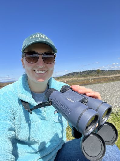 Liz Allyn holds binoculars