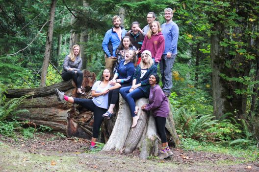 A group of SAFS students pose in the forest during a retreat.